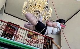 asian-girl-bound-gagged-and-suspended-in-bdsm-session